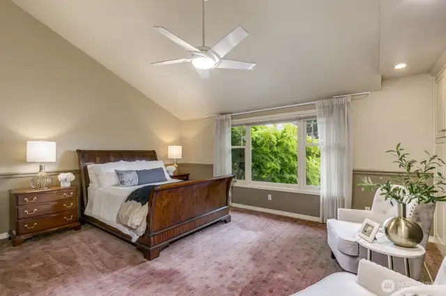 Primary suite with vaulted ceiling.