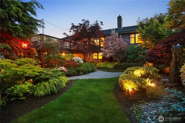 Beautifully landscaped backyard with detached garage off of alley and shop above.