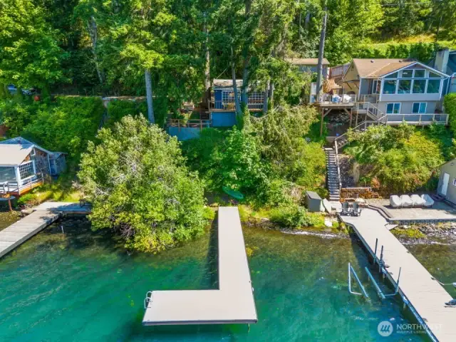 Private dock with swim ladder and clear view of Summit Lake shoreline and trees.