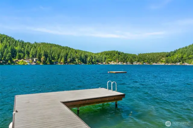 Private, low-maintenance dock built with composite decking, steel piers, and a swim step, set against open lake views.