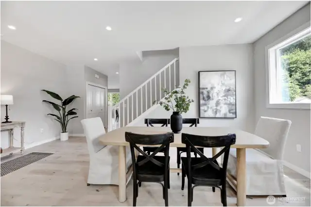 Entry, living & dining room. Previous built Peak house. Finishes may be different.