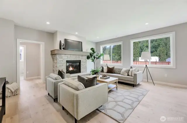 Family room with gas fireplace. Previous built Peak house. Finishes may be different.