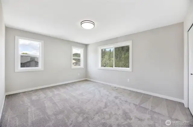 2 of 4 upstairs bedrooms. Previous built Peak house. Finishes may be different.