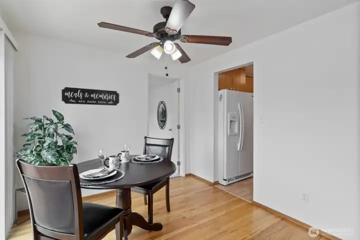 Breakfast nook area just outside the kitchen, steps to the huge deck. Ceiling fan works great on those hot evenings.