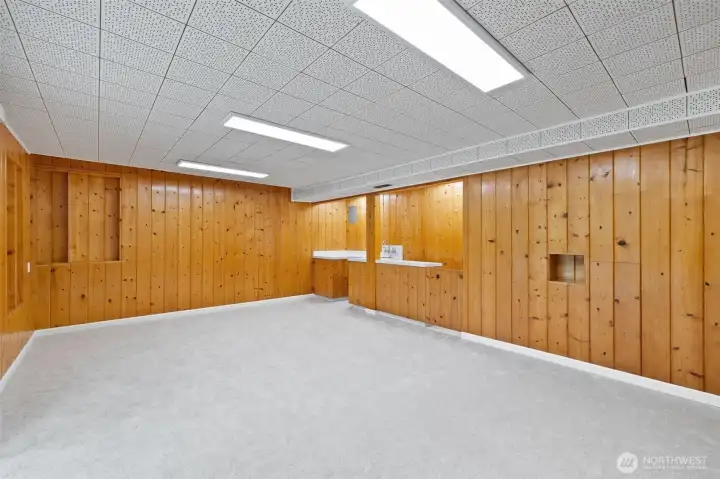 Lower level also has a sink/wet bar area, room for small fridge in cabinet and a closet for additional storage.