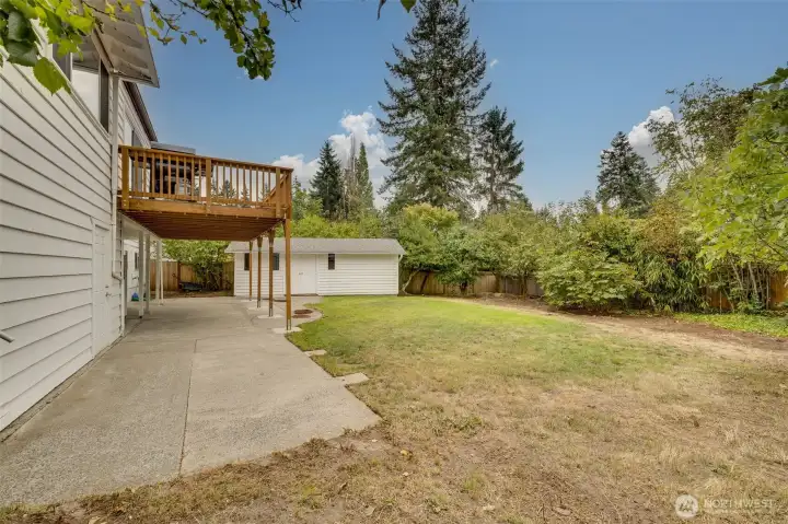 The spacious backyard has an amazingly large shop, patio. You will find plum tree, pear tree and beautiful Lilac trees that bloow every spring.