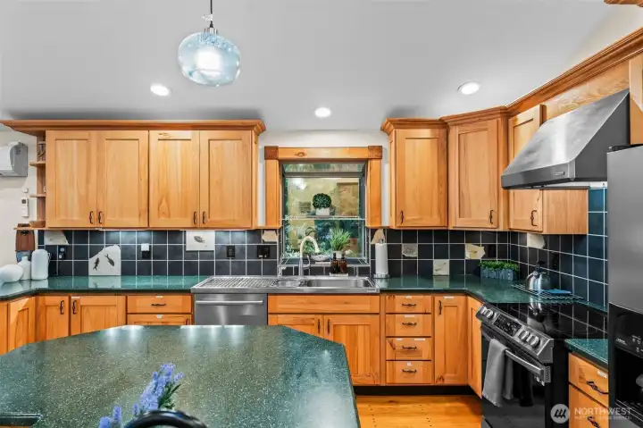 Corian counters and solid wood cabinets. Currently an active Airbnb, it is set up for your guests if you wish to use it as an investment as well!