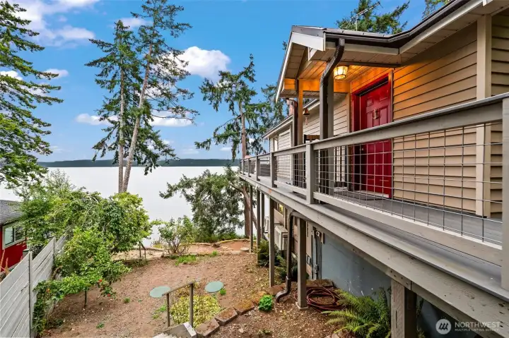Fenced in side yard includes fruit trees (plum & apple). Notice the wrap around top deck.