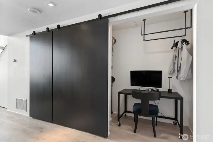 Closet/den with sliding door. The seller uses it as an office and closet