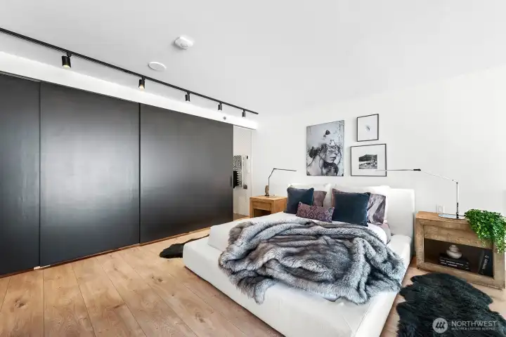 Upstairs, discover the expansive primary bedroom, complete with an ensuite bathroom and a walk-in closet, both offering sliding doors for enhanced privacy