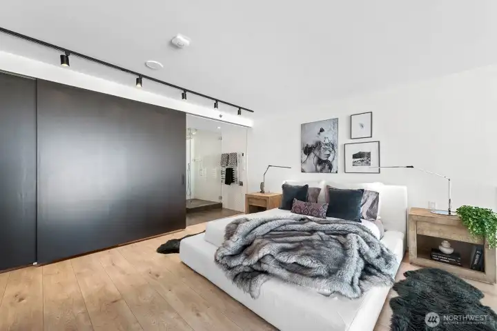 Upstairs, discover the expansive primary bedroom, complete with an ensuite bathroom and a walk-in closet, both offering sliding doors for enhanced privacy
