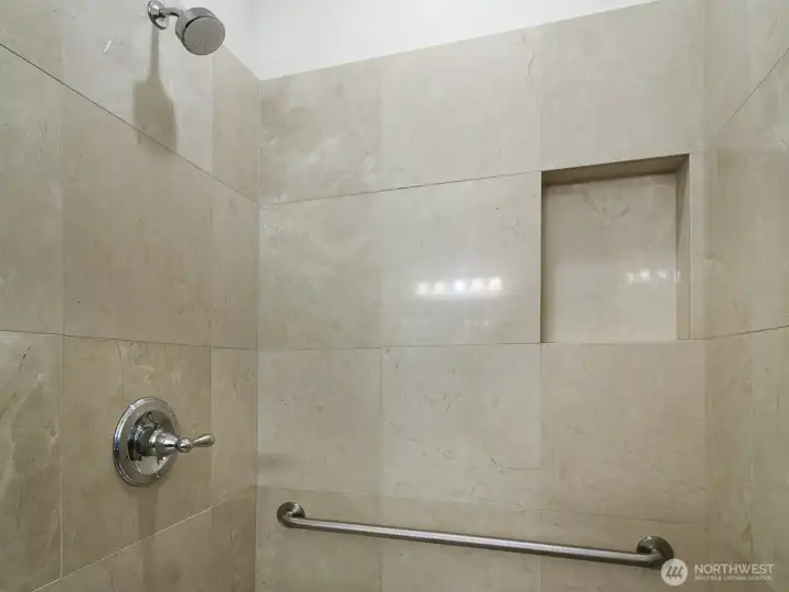 Tile Shower With hand rails.