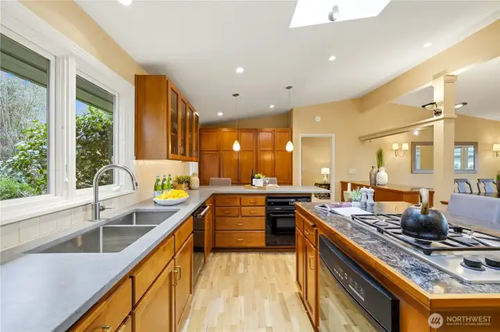 Another view of the kitchen. The window above the sink looks out to the beautifully landscaped yard.