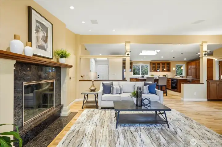 Looking toward the entry and the kitchen from the living area.