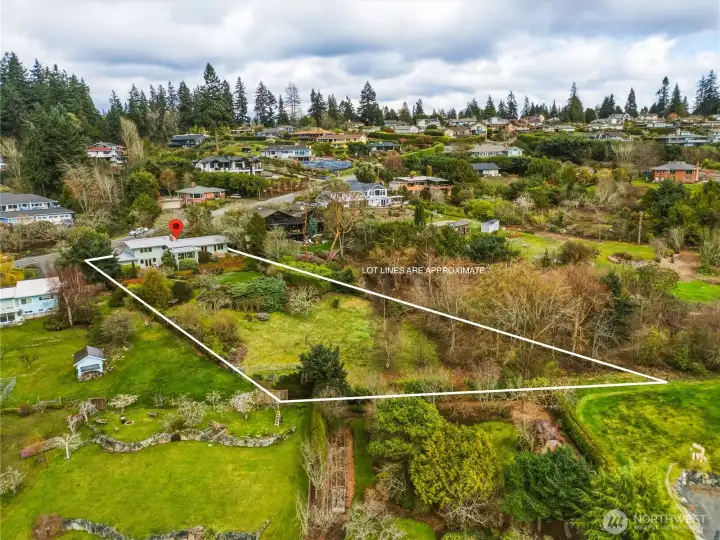 Aerial view of the property with approximate lot lines shown.