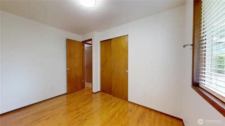 Second of three bedrooms looking back to the hallway.