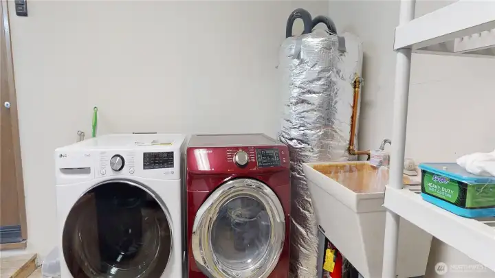 The washer and dryer have dedicated space in the 1-car garage with convenient utility sink.