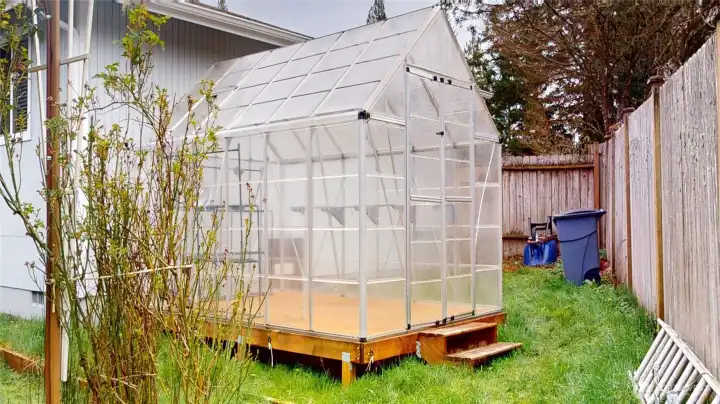 This greenhouse is a gardeners delight! Grow year round with this lovely addition.