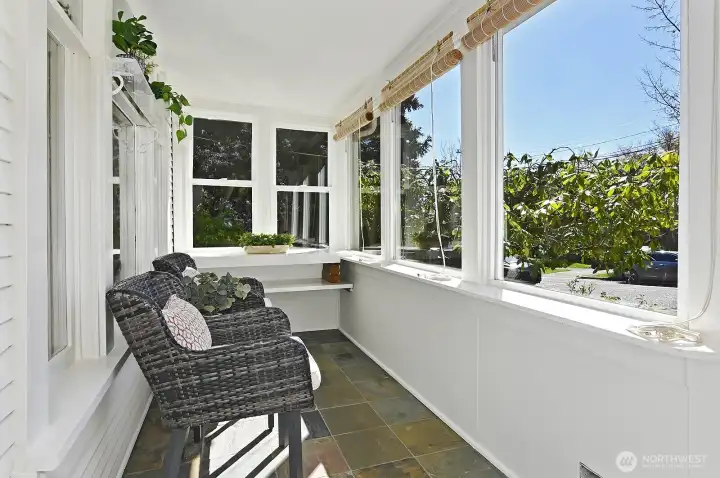 Sun room porch provides pleasant entry and all-season relaxation.