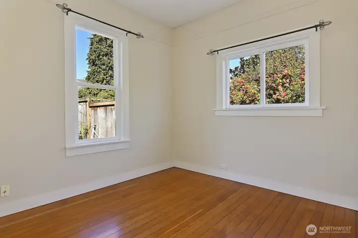 First of two generous main floor bedrooms.