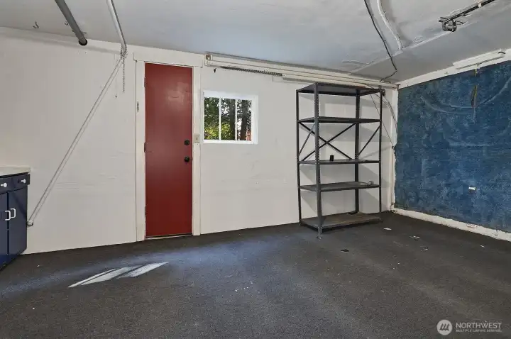 Garage currently used as large, shared storage.