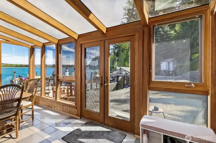 Dining entry sunroom surrounded by glass