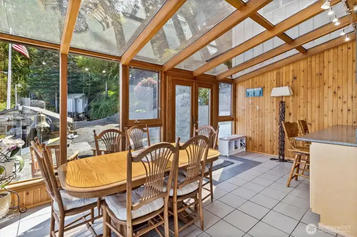 A light-filled dining sunroom extends the living space at 1442 Seacrest with walls of glass overlooking the shoreline & beach-level entertaining areas below. Positioned just steps from the water’s edge, this inviting gathering space captures sunrise light, marine activity & year-round wildlife...including the occassional migrating whale!!