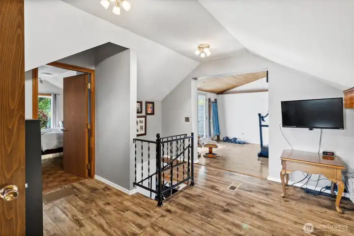 A spacious circular stairway brings you to this upper-level bonus landing area providing flexible space ideal for office use, media area, guest overflow or quiet retreat.