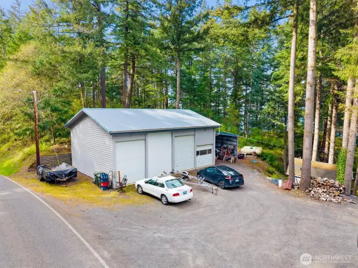 On the buildable lot, you've got a 1200 square foot shop with with power, propane, and mezzanine.  4 oversized doors (13’6”, two 12’, one 8’). Ideal for storage, marine use, hobby space or future homesite.