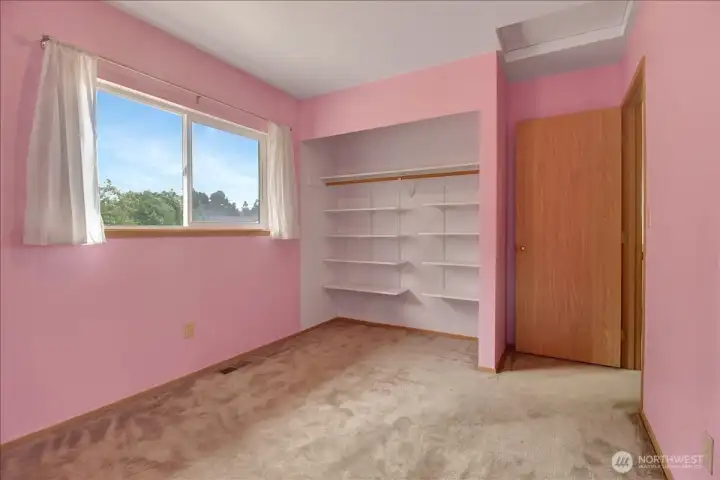 Bedroom #3 set up as craft from. Closet doors in garage Bedroom #3 set up as craft from. Closet doors in garage
