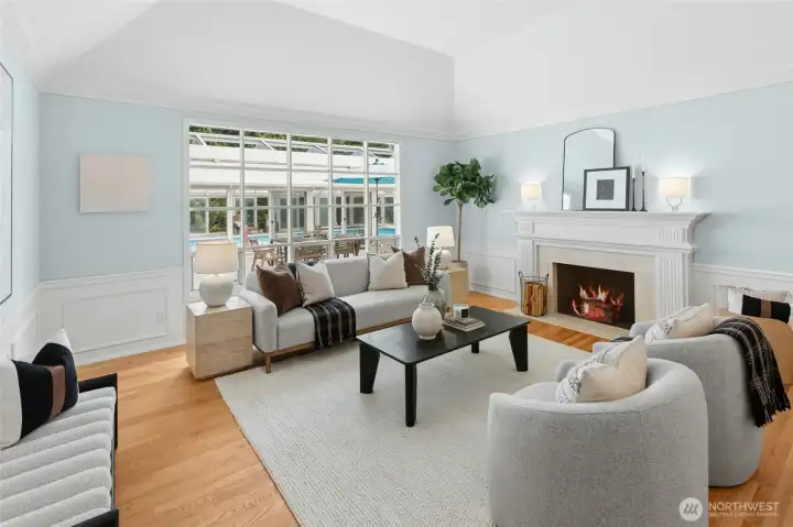 Living room with wood burning fireplace.