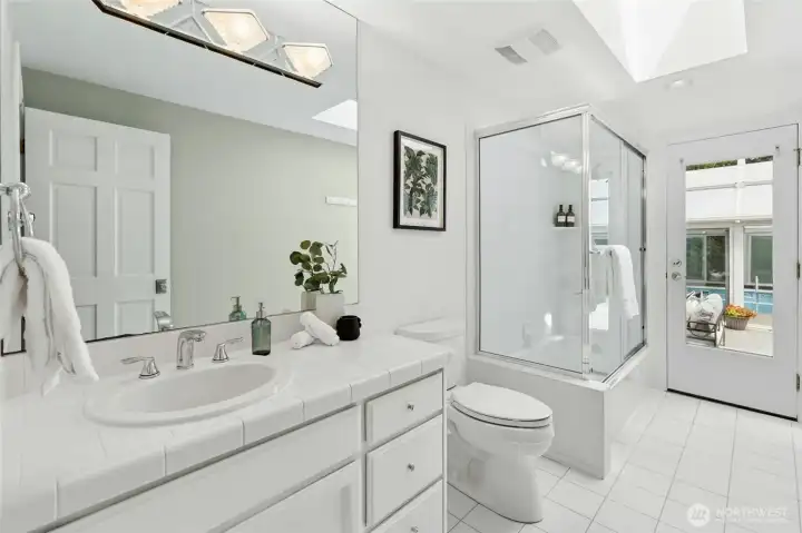 Shared hall bath. Opens to the courtyard so perfect for pool use.