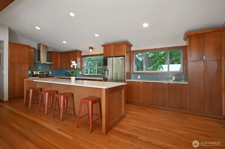 Generously sized island and room for a dining table off to the right. Abundant cabinets for all your cookware. Generously sized island and room for a dining table off to the right. Abundant cabinets for all your cookware.