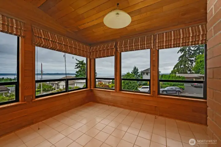 This sun room is a great spot to read or dine. This sun room is a great spot to read or dine.