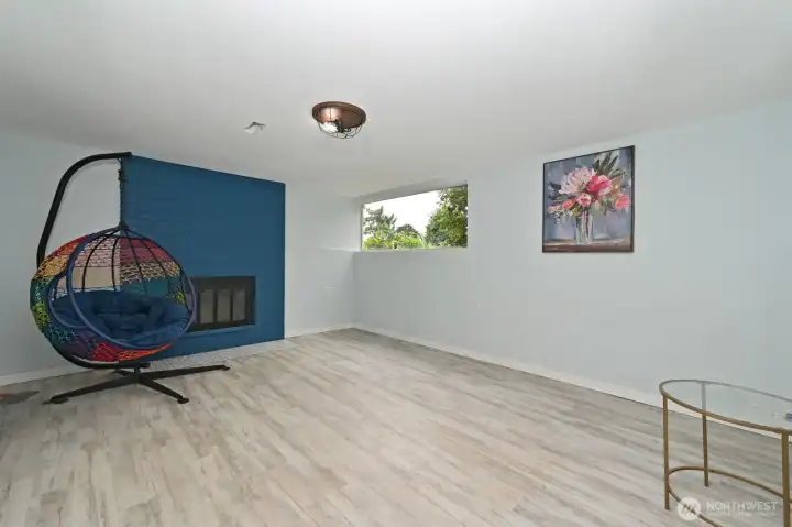 Family room on the lower level with newer plank flooring. Family room on the lower level with newer plank flooring.
