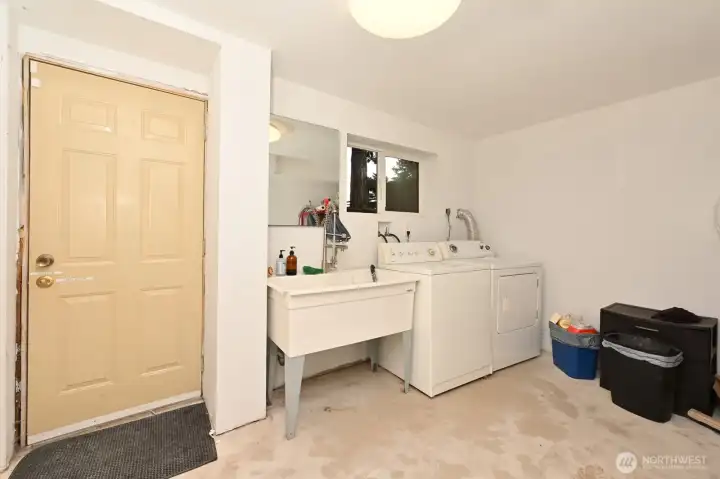 Laundry room with door out to the back yard. Laundry room with door out to the back yard.