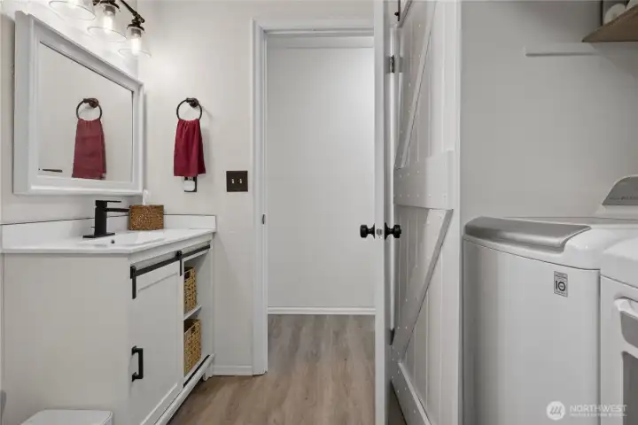 3/4 bathroom next to bedroom 2 with laundry & hot water tank access 3/4 bathroom next to bedroom 2 with laundry & hot water tank access