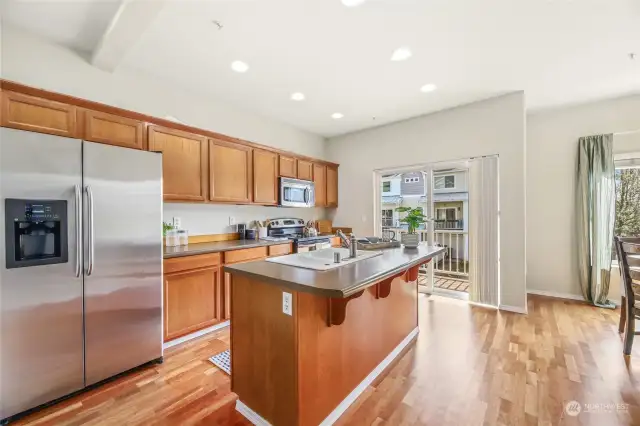 Bright Kitchen with tons of Cabinet Storage and Private Deck.