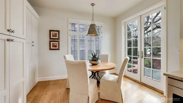 Dining nook off kitchen with French doors to patio and generous pantry with pull out drawers.