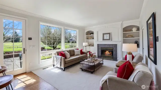 Family room with custom built-ins and French doors leading to patio overlooking the 16th Fairway. Glass pocket door (not shown) on the right was added to access the den.