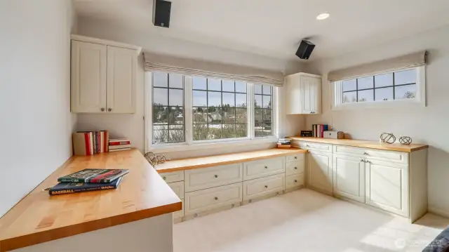 Expansive workstation in the upstairs bonus room with golf course views.