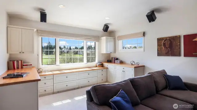 Expansive workstation in the upstairs bonus room with golf course views.
