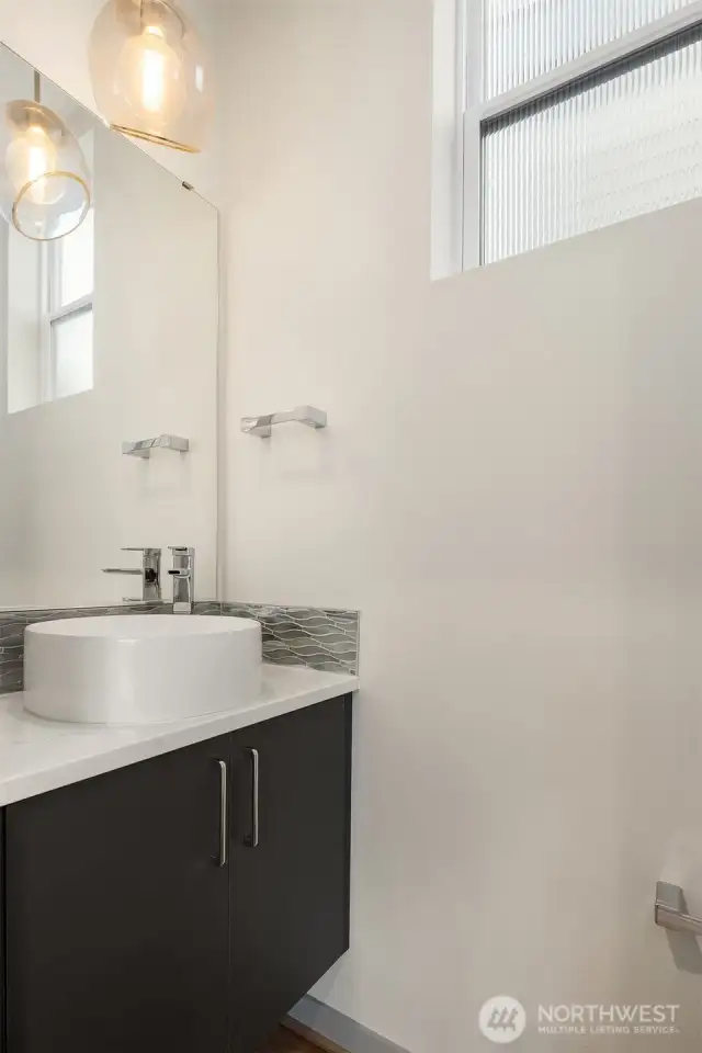 Powder room on kitchen and living room level.