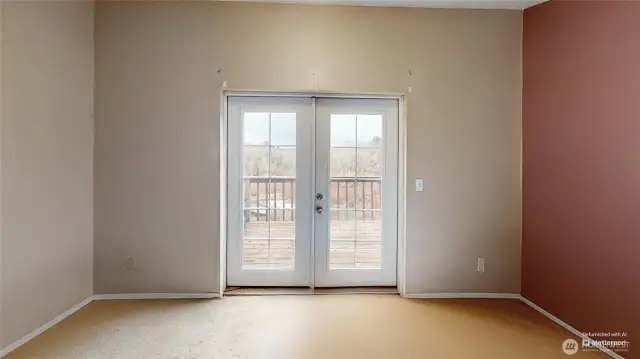 Upstairs bedroom with french doors leading out to private deck. Photo is digitally altered.