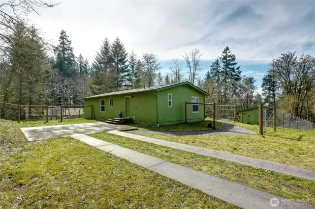 The driveway and parking pad are substantial.  The 6" deep parking pad of poured concrete is sturdy enough to hold a garage or carport, or even an ADU.