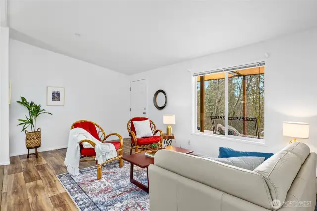 Another angle of the sitting area showcases its abundant natural light and inviting ambiance.