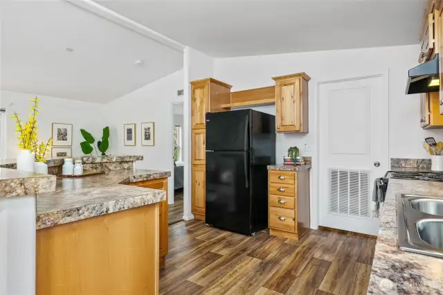 With ample counter space for food prep and like-new appliances, this home feels fresh and barely lived in.