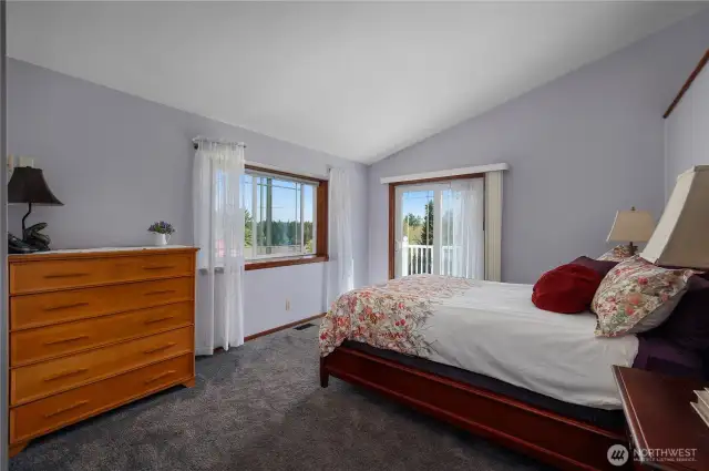 Primary bedroom has a cozy balcony.