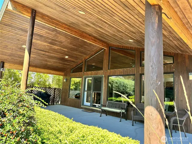 Gorgeous covered patio looking out to the canal and beautifully land scape yard