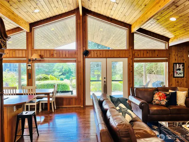 Large windows overlooking the beautiful, landscaped yard and canal